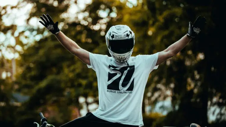 man in white and black nike crew neck t-shirt wearing black and white helmet