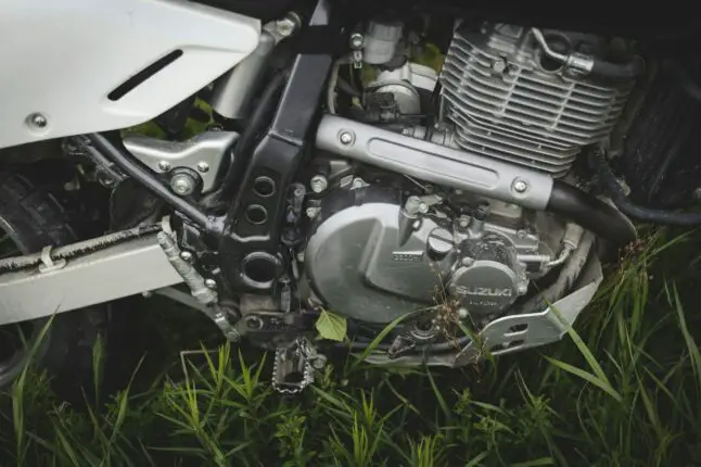 black and silver motorcycle on green grass